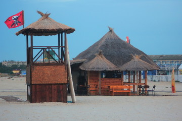  Bar and wooden tower on the sand.