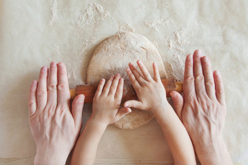 Concept preparing food with child in the kitchen, home leisure