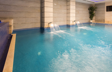 Swimming pool in hotel spa and wellness center