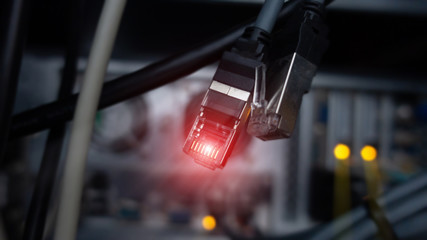 Lan connectore close up. Datacenter server room background. Technology concept 2.0