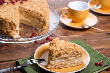 piece of puff cake with cake cream on a served table