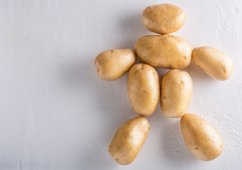 Fototapeta na wymiar Raw organic potatoes on a white background