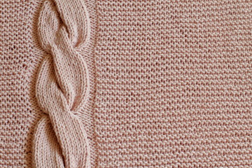 Exclusive delicate pink knitted background with vertical knitted oblique. Handmade. Minimal style.