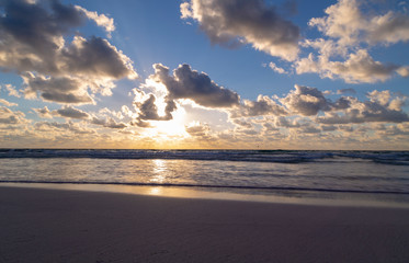 Naklejka na ściany i meble Sunset over the beach of the Mayan Riviera in Tulum, Quintana Roo, Mexico