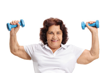 Elderly woman exercising with dumbbells