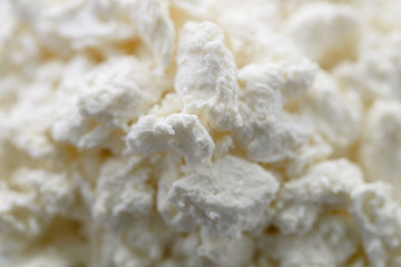 Cottage cheese close-up. A healthy dairy product. Proper nutrition for breakfast.