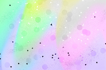 pink and blue confetti and stars and sparkles on pink background. Top view, flat lay. Copyspace for text. Bright and festive holiday background. Neon colors. Waporwave style