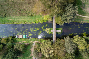 Aerial image of a bridge and a water inlet in the river Niers in Germany