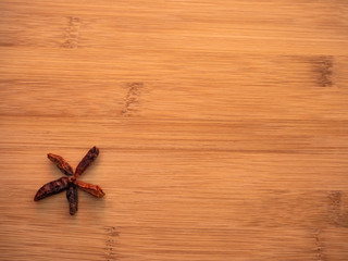 Spicy cayenne on a wooden table