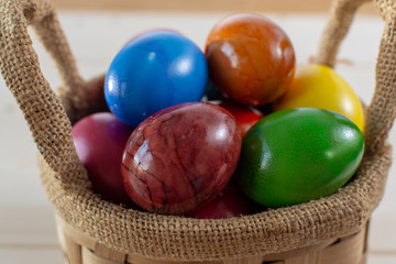Cooked chicken eggs for Ester celebration dinner, colorful painted with organic paint ready to eat