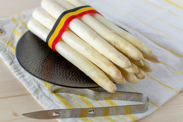 New harvest of white asparagus, high quality Belgian asparagus with ribbon in colors of Belgian flag