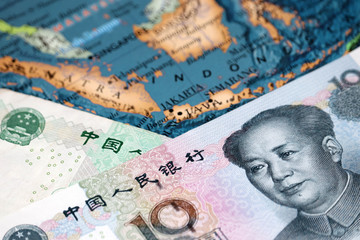 Yuan on Indonesia map. Concept for trade between the China and Indonesia, chinese investment in indonesian economy, tourism concept