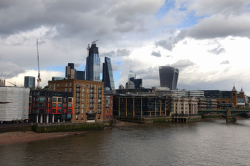 Photo from iconic modern skyscrapers in business district of Bank in the heart of London on a cloudy sky, London, United Kingdom