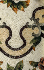 Detail of a beautiful marble mosaic panel. Interior marble mosaic. A piece of marble Venetian mosaic as a decorative background .. Selective focus