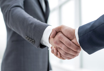 close up.handshake business partners.