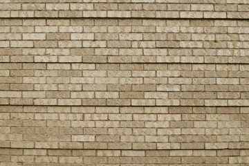 Fototapeta na wymiar Old beige brick wall background texture