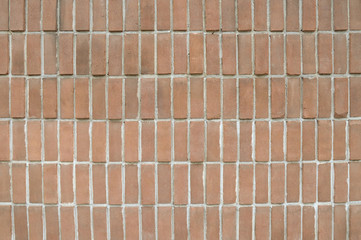 Old red brick wall background texture close up