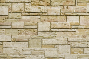 Old beige stone wall background texture