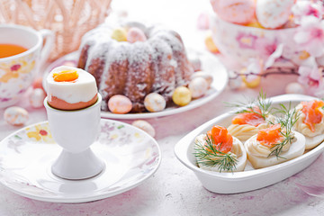 Easter breakfast.Cake and eggs with salmon