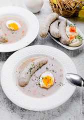 Easter breakfast. Sour rye soup with eggs and sausage
