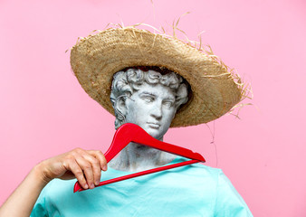 Antique bust of male in hat with red hanger