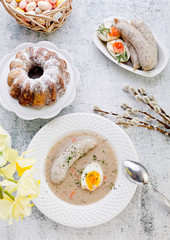 Easter breakfast. Sour rye soup with eggs and sausage