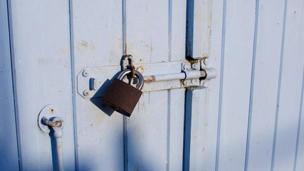 Pad-locked fisherman's quayside store room door