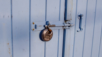 Pad-locked fisherman's quayside store room door