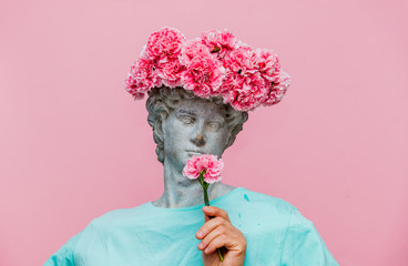 Antique bust of male with carnations bouquet in a hat