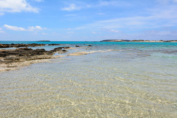 Fototapeta na wymiar Elafonisi beach with crystal clear water in summer day. Crete Island, Greece
