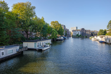 Fototapeta na wymiar Amsterdam, Netherlands - September 02, 2018: Street and canals view in Amsterdam Netherlands