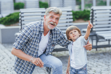 Grandfather with a grandson on a walk