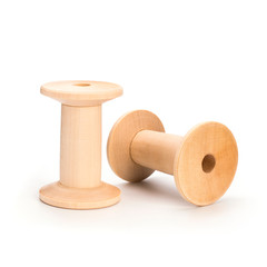 Wooden reel on a white background