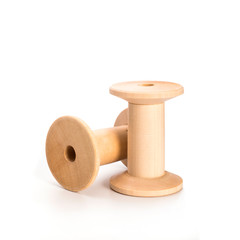 Wooden reel on a white background