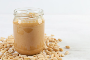 peanuts and peanut butter in a jar on the table
