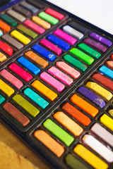 Pastel crayons paint special palette box.  Accessories and tools of the artist for drawing.
