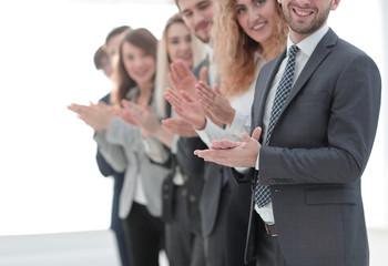 smiling business team applauding.