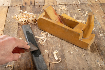 Strug in an old carpentry workshop. Sharpening and conservation of the old carpentry tool.