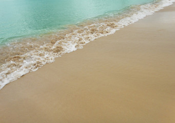 Wave of the sea on the sand beach