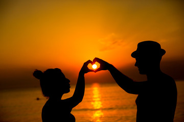 loving couple by the seaside sunset