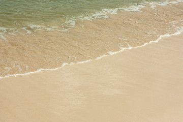 Soft wave of blue ocean on sandy beach. Background