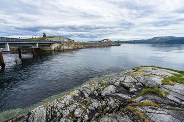 Cloudy landscape with two of the most famous bridges of Norway’s Atlantic Road: Hulvagen Bridge on the left and Storseisundet Bridge in the background