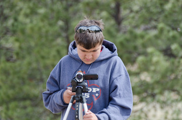 Young Cinematographer Outdoors Front View