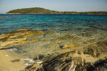 picturesque tropic wilderness scenery landscape sand and rocky beach with view on vivid colorful...