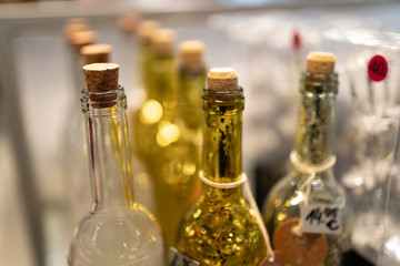 Yellow and white glass bottles in a shop