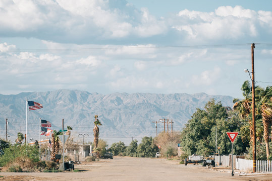A street and mountains in Bombay Beach, on the Salton Sea in California