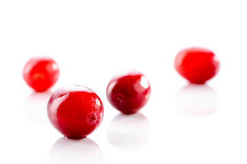 wet cranberries close-up isolated on white background 