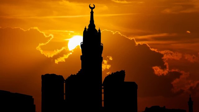 Mecca Clock Tower, Skyline in Silhouette with Abraj Al Bait, Time Lapse at Sunset, Saudi Arabia