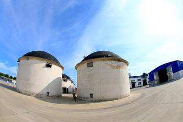 Obraz premium Old silos where grain is stored against a blue sky