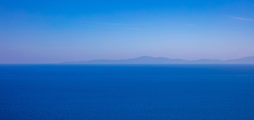 Greece. Aegean sea. Blue sky and calm sea water texture background